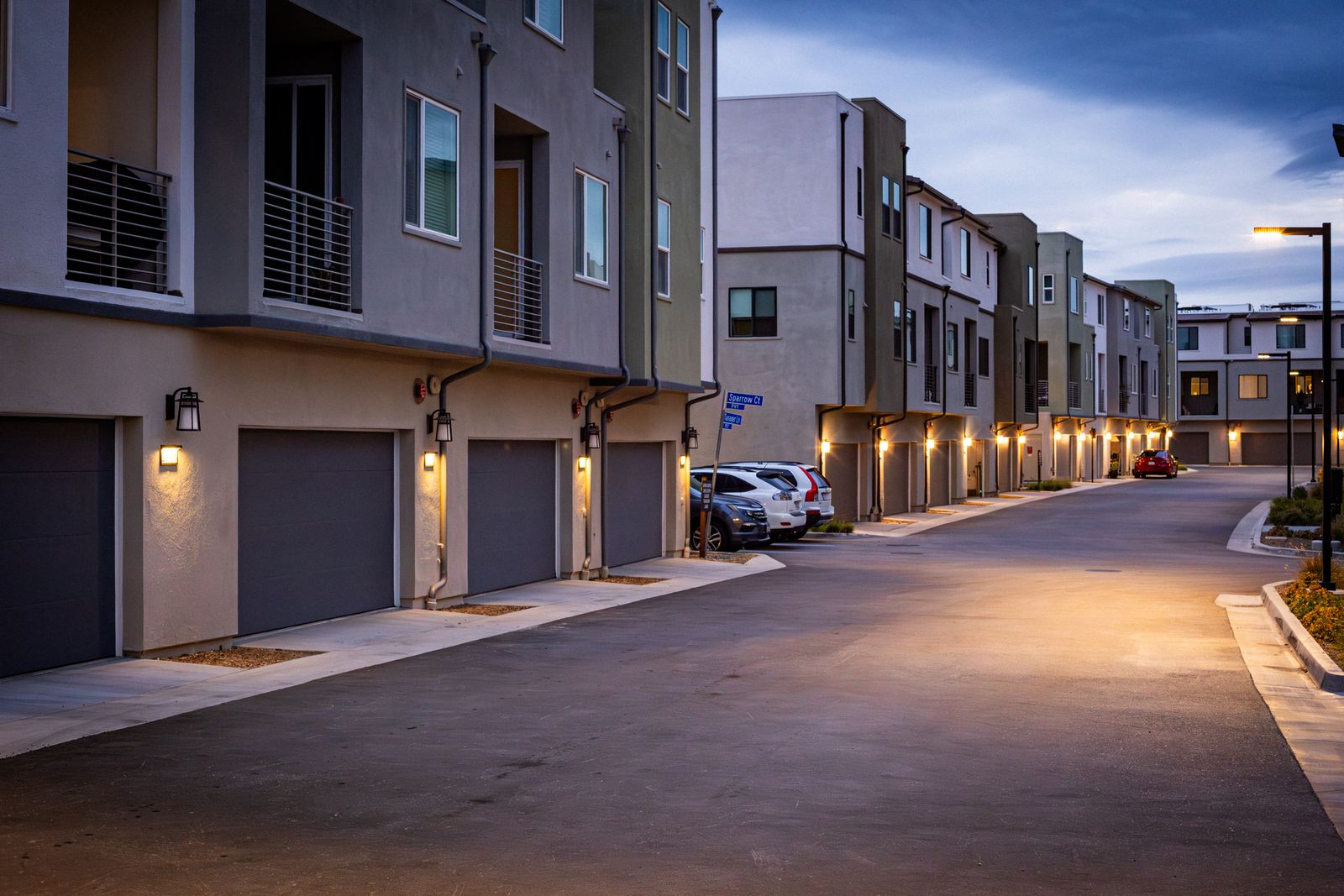 Quiet Volusia County residential street at dusk with warmly lit homes